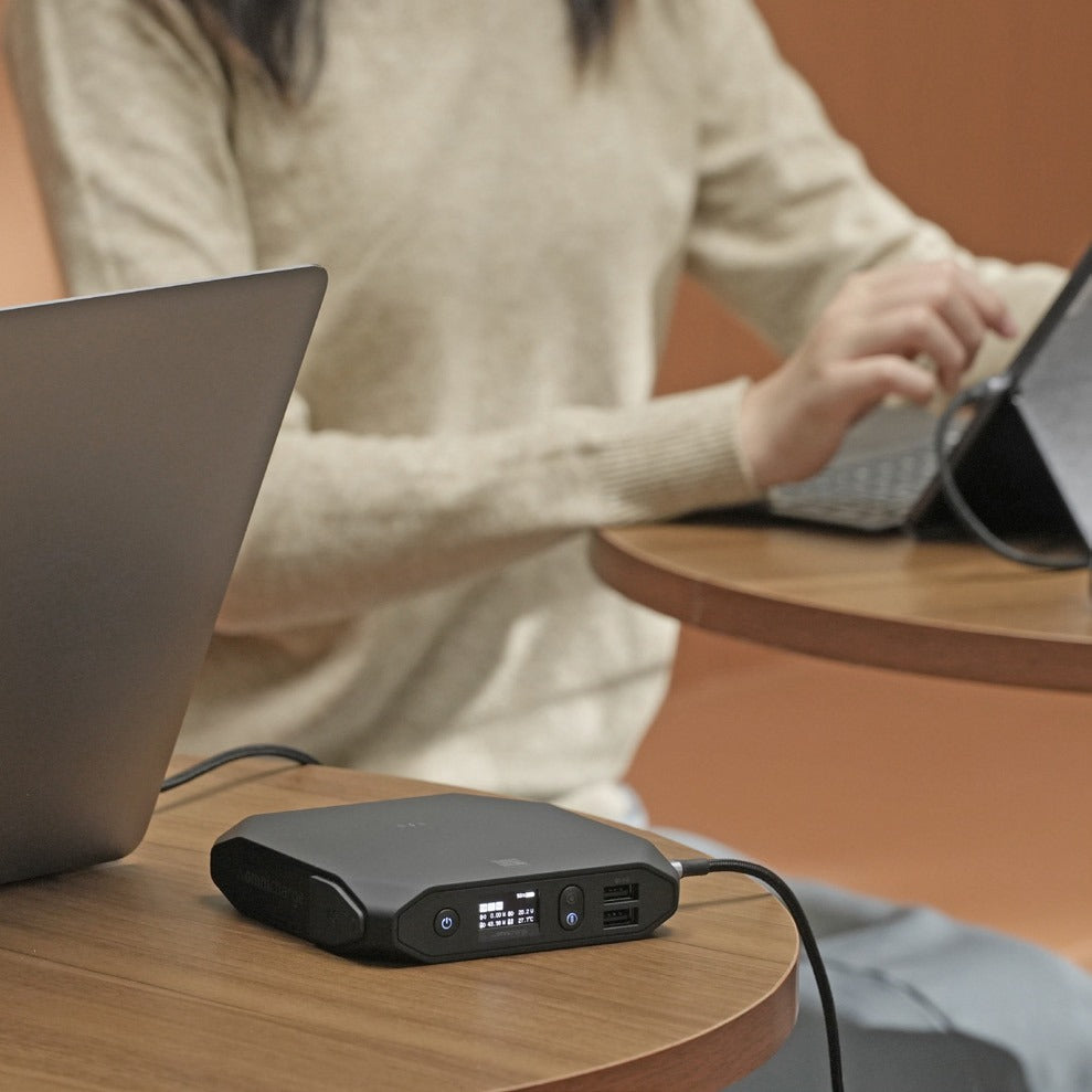 Student with a tablet and an Omni power bank